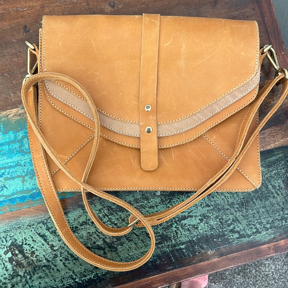 Genuine camel colored leather Sseko crossbody bag.